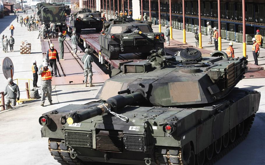 U.S. Army M1A1 tanks of 11th Armor Cavalry Regiment from the National Training Center at Fort Irwin, California, are loaded onto trains during joint exercises with South Korea, dubbed Key Resolve and Foal Eagle, at Camp Carroll, in Waegwan, South Korea, Thursday, March 3, 2011.
