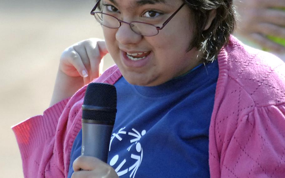 Christie Bohne, a Ramstein High School ninth-grader, recites the Special Olympics oath "Let me win. But if I cannot win, let be brave in the attempt," during the opening ceremony at the 2011 Special Olympics in Enkenbach-Alsenborn, Germany. Around 600 American and German athletes, along with about 1300 volunteers participated in the event on Thursday.