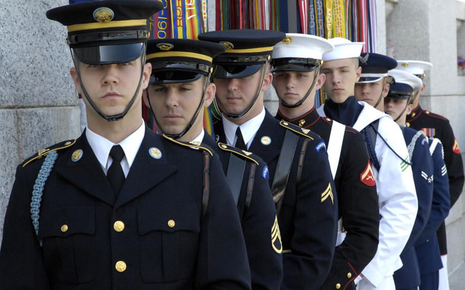 The honor guard awaits the start of Monday's ceremony at the national World War II Memorial.