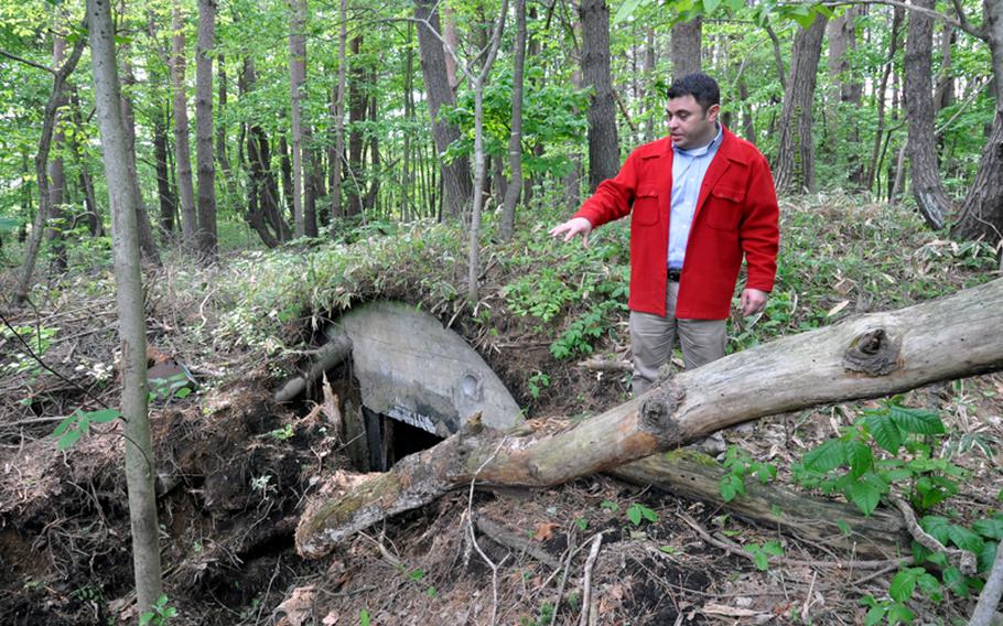 Richard Clark, 35th Fighter Wing historian, explains Thursday how a couple of airmen accidentally discovered what is believed to be a World War II-era, Japanese military bunker in the woods on Misawa Air Base, Japan.