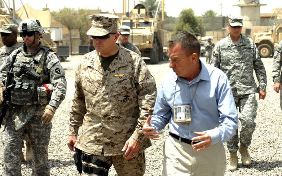 Lt. Gen. John Allen, center, speaks with a member of a Provincial Reconstruction Team 6 in Iraq. Allen was selected to succeed Gen. David Petraeus as the commander of the Afghanistan war.