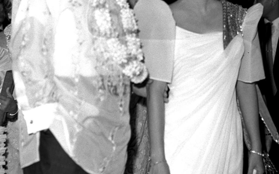 President Johnson talks with Philippine first lady Imelda Marcos.