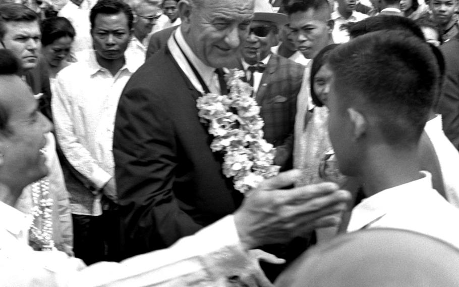 President Johnson mingles with the crowd during the Manila Summit.