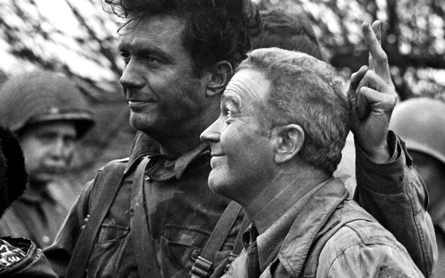 Cliff Robertson and Red Buttons pose for a photo on the set of "Up from the Beach."
