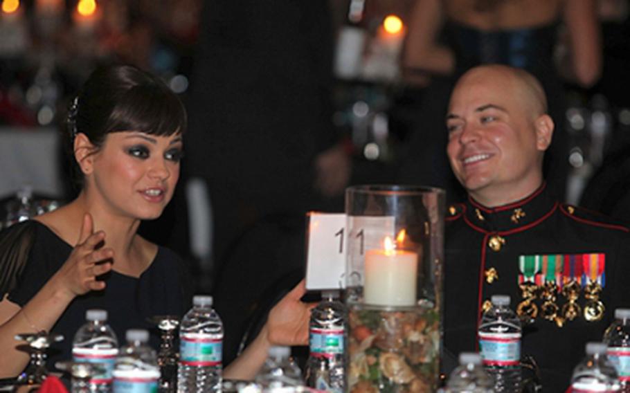 Sgt. Scott Moore and his guest, actress Mila Kunis, attend the 236th Marine Corps birthday ball for 3rd Battalion, 2nd Marine Regiment, 2nd Marine Division in Greenville, N.C., Nov. 18, 2011.