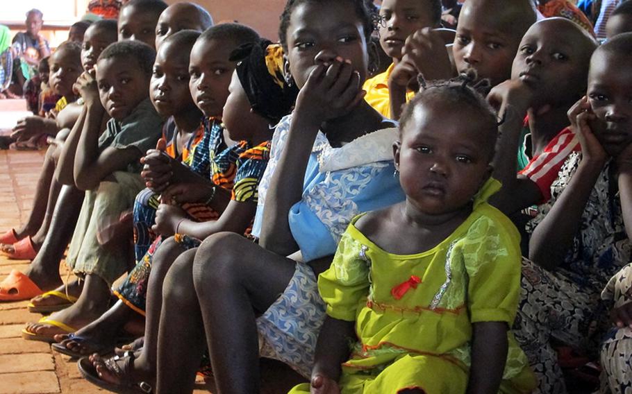 Children sit up front at a January, 2012 Catholic church service in Obo, Central African Republic, where U.S. special operations forces assisted in a mission against the Lord's Resistance Army rebel group.