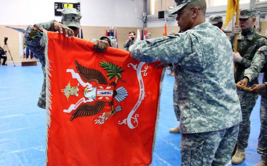 The 44th Expeditionary Signal Battalion's colors are cased at a March, 2011 ceremony in Schweinfurt, Germany, signifying the beginning of the unit's journey to Afghanistan.