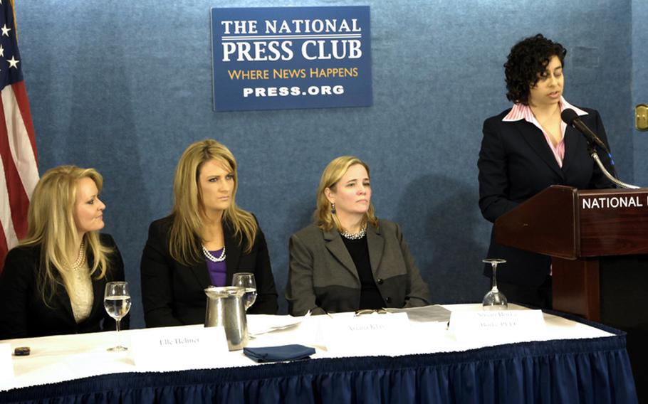 Left to right, Elle Helmer, Ariana Klay and Susan Burke listen as Anu Bhagwati, executive director of the Service Women's Action Network, speaks during Tuesday's press conference at the National Press Club. Burke is the attorney for Helmer, Klay and others who are suing current and former leadership of the Navy and Marine Corps.