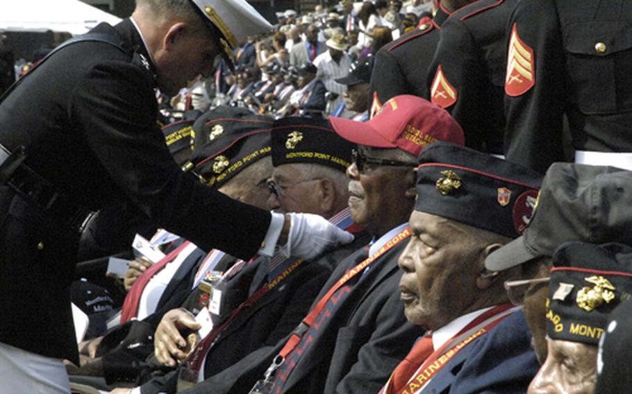 Montford Point Marines are presented with replicas of the Congressional Gold Medal during a ceremony at Marine Barracks Washington on June 28, 2012.