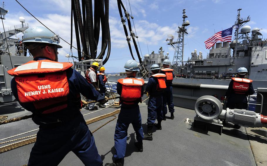 Sailors prepare to transfer biofuel to the guided-missile cruiser USS Princeton during the Great Green Fleet demonstration as part of Rim of the Pacific 2012 in July.