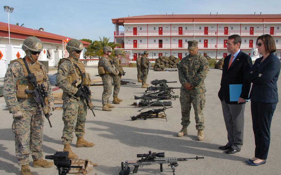 Marines assigned to Fleet Antiterrorism Security Team Company Europe brief U.S. ambassador to Spain and Andorra Alan Solomont on some of the weapons that are used while deployed during a visit to Naval Station Rota, Spain in this March 2012 photo.