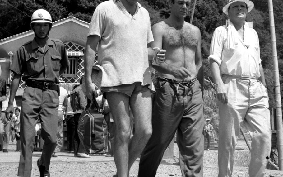Sean Connery with his security detail, during the filming of ''You Only Live Twice.'' At right is Desmong Llewelyn (''Q'')
