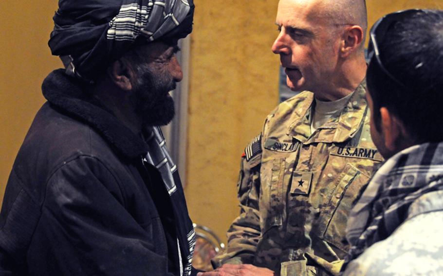 Brig. Gen. Jeffrey A. Sinclair greets an Afghan leader before the Combined Team Zabul Winter Operations Back Brief for American and Afghan key leaders at Forward Operating Base Eagle, Nov. 16. 2011.