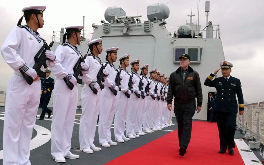 Chinese sailors render honors to Secretary of the Navy Ray Mabus during a visit to the People's Liberation Army Navy hospital ship Peace Ark on Nov. 30, 2012.