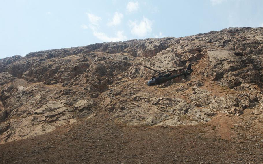 An SA 342M Aerospatiale Gazelle light multi-purpose helicopter provides air support for a convoy outside of Forward Operating Base Tagab, Kapisa province, Afghanistan, Sept. 26, 2012. The supply convoy was headed towards FOB Tagab.