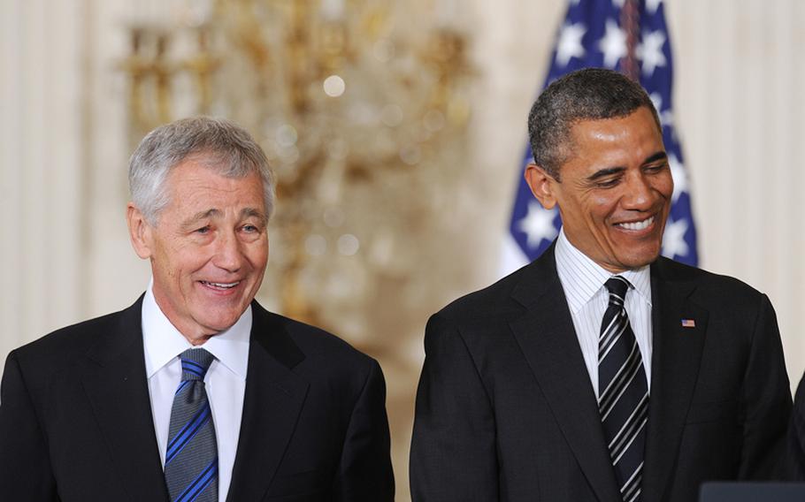 Former U.S. Senator Chuck Hagel, left, a Republican from Nebraska, is nominated to be Secretary of Defense by President Barack Obama at the White House on Monday, January 7, 2013, in Washington, DC.