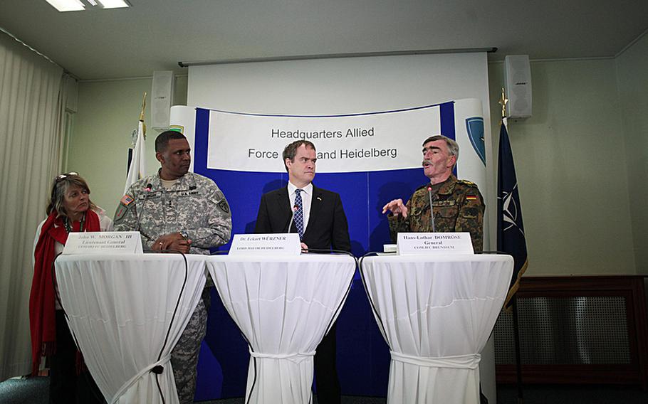 U.S. Army Lt. Gen. John W. Morgan III, commander of NATO's Headquarters Allied Force Command Heidelberg; Heidelberg Mayor Eckart Wurzner; and German Gen. Hans-Lothar Domrose, commander of NATO's Allied Joint Force Command Brunssum, answer questions at a press conference Thursday after the deactivation of Morgan's unit, a fixture in NATO --- though under many different names --- for 61 years.