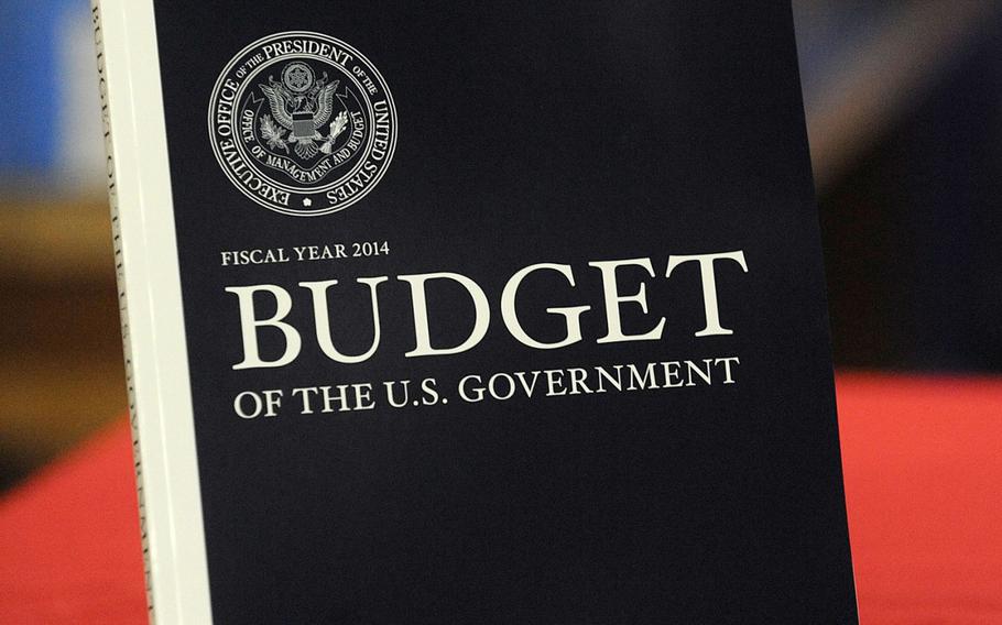 Workers at the US Government Printing Office monitor volumes that are part of the 2014 Budget, Monday, April 8, 2013, in Washington, D.C. President Barack Obama released the 2014 spending budget on April 10.