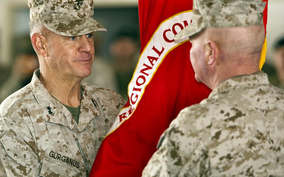 Maj. Gen. Charles M. Gurganus passes the colors to Maj. Gen. Walter L. Miller, Jr. during the transfer of authority ceremony on Camp Leatherneck, Afghanistan, Feb 28, 2013. Maj. Gen. Walter L. Miller, Jr. relieved Maj. Gen. Charles M. Gurganus as the commanding general of Regional Command (Southwest).