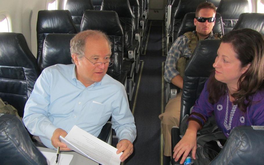 Special Inspector General for Afghan Reconstruction John F. Sopko, works while en route to Herat, in August 2012.