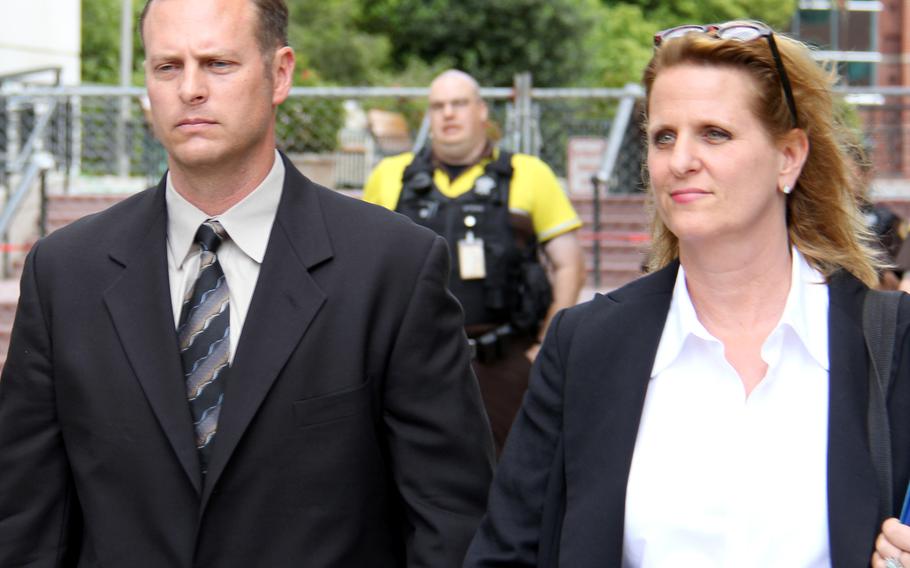 Lt. Col. Jeffrey Krusinski, the Air Force’s point man on sexual assault prevention programs, leaves Arlington County courthouse in May 2013 with his attorney after not entering a plea to one count of sexual battery.