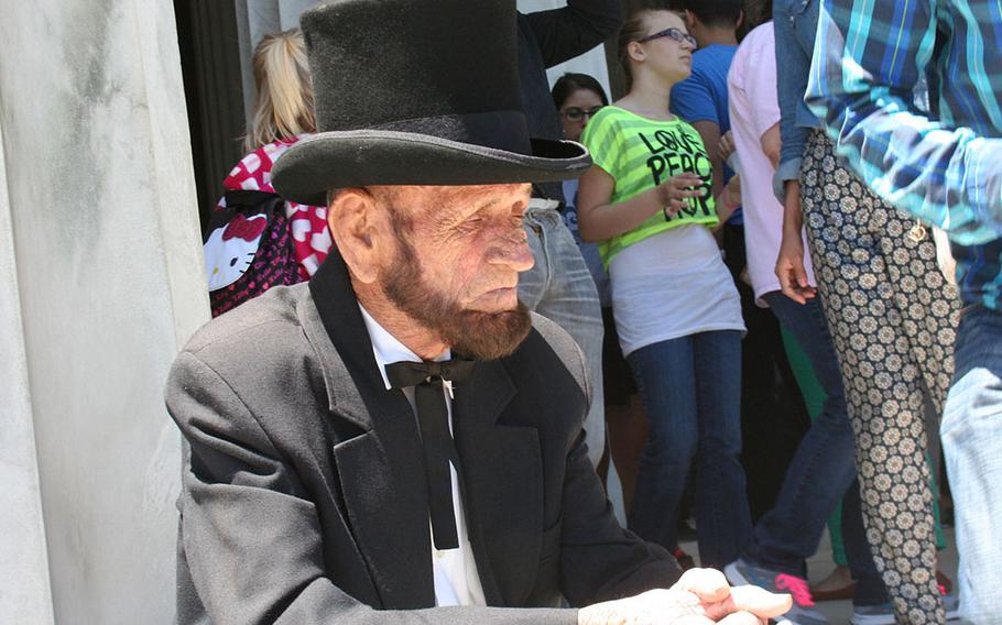 Abraham Lincoln impersonator posed for photos with tourist at the Lincoln Memorial on Memorial Day weekend.