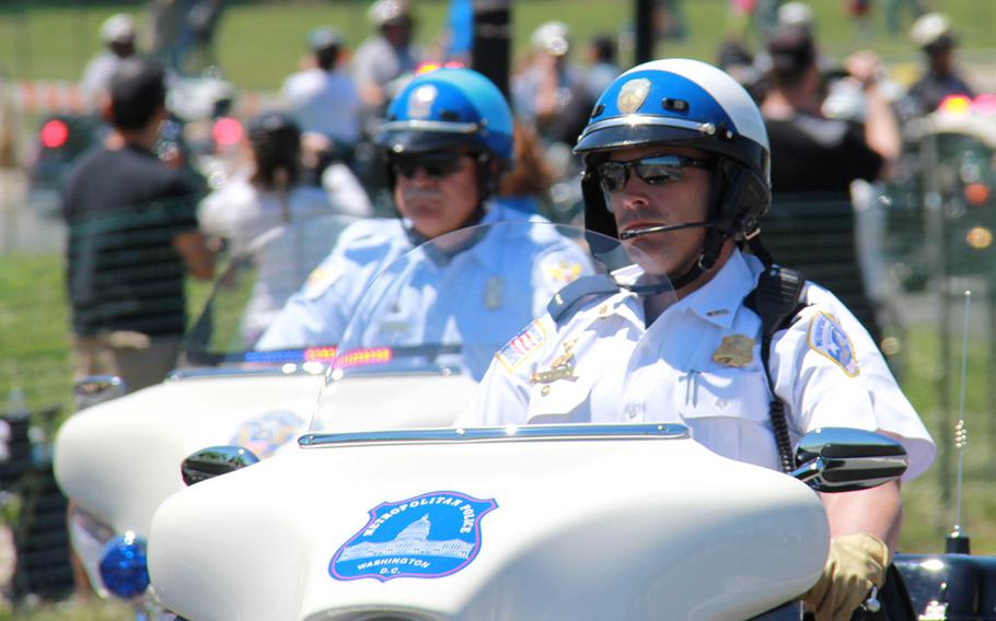 Washington DC Metropolitan police lead the XXVI Rolling Thunder riders across the Memorial Bridge.
