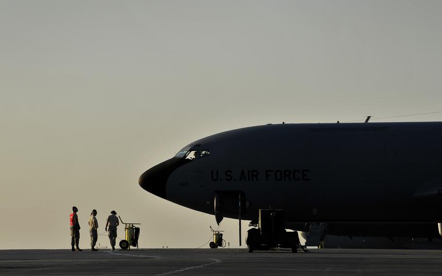 A U.S. KC-135 Stratotanker maintenance crew performs pre-flight procedures before an air refueling over Afghanistan at Transit Center at Manas, Kyrgyzstan in this August 2012 photo.