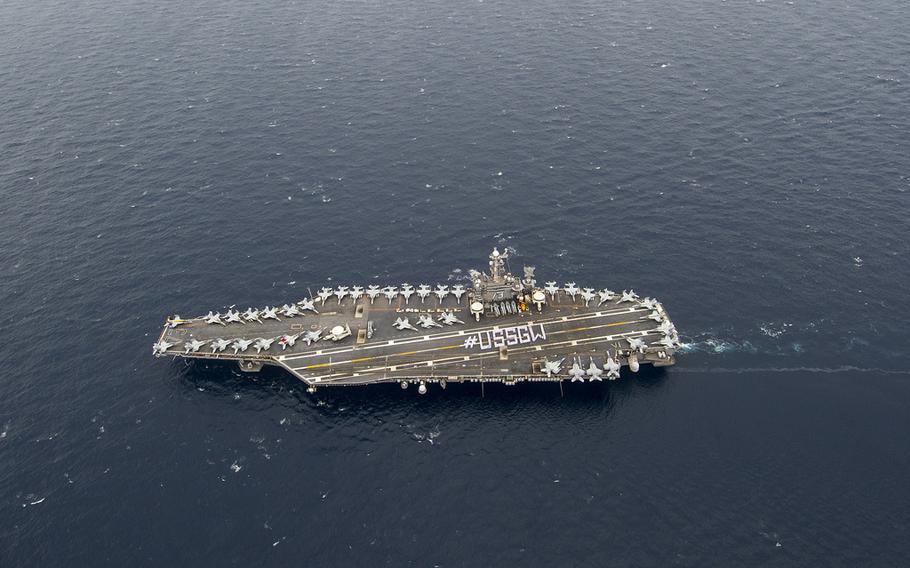 The aircraft carrier USS George Washington moves in the Philippine Sea, Sept. 29, 2013.