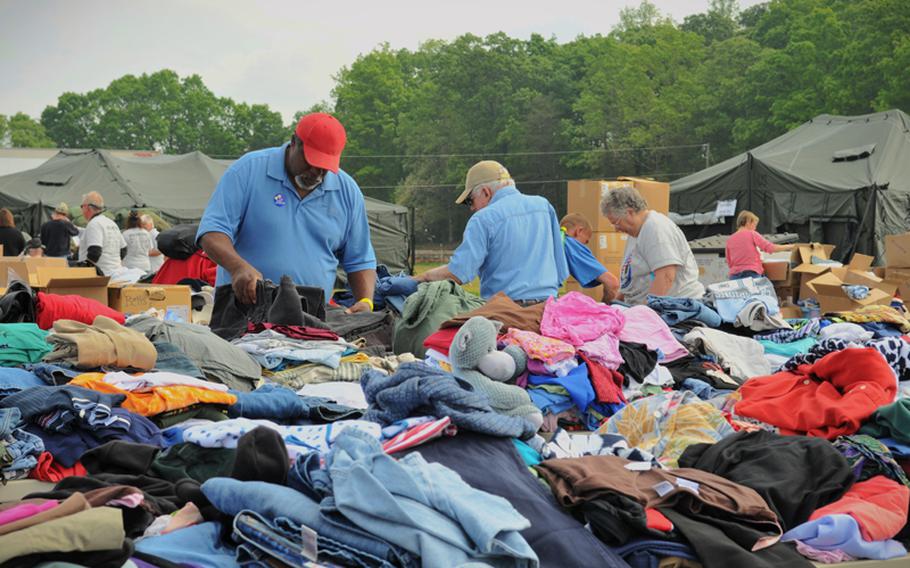 A veteran sorts through donated clothes during the Department of Veterans Affairs' Annual Stand Down Against Homelessness at the Hickory Legion Fairgrounds in Hickory, N.C., on April 2012.
