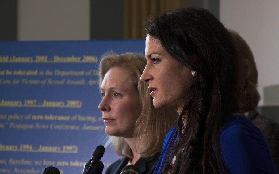 Ariana Klay, a former Marine officer and military sexual assault survivor, speaks in Washington, D.C. on Nov. 6, 2013, as Sen. Kirsten Gillibrand, D-NY, (background) looks on. Gillibrand is leading a bipartisan push calling for military sexual assault cases to be removed from the military chain of command.