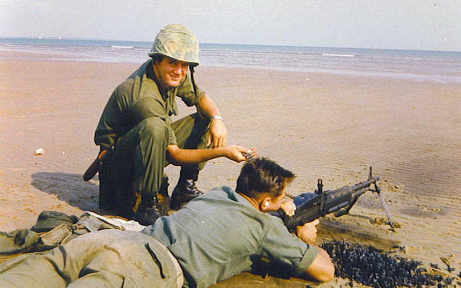 Marine Cpl. Gregory Harris, left, is seen here smiling as he feeds ammunition during training. Harris was declared missing following a 1966 ambush in Quang Ngai Province, South Vietnam.
