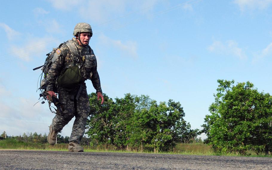 An Army Reserve soldier completes a ruck march during an Army Reserve Best Warrior Competition at Fort McCoy, Wis., on July 15, 2009.