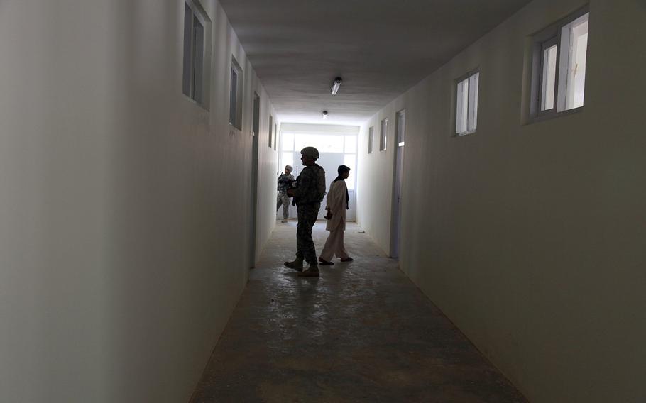 U.S. servicemembers from the Kapisa-Parwan Provincial Reconstruction Team visit a construction project in Farukh Shah, Afghanistan, on Aug. 12, 2009.