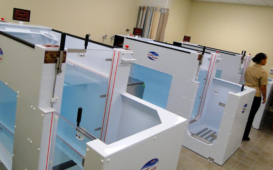 The physical and occupational therapy clinic at the new Naval Hospital Camp Pendleton is equipped with 3 underwater treadmills, shown, as well as exercise machines, driving simulators and a mock apartment to help injured Marines and sailors heal.
