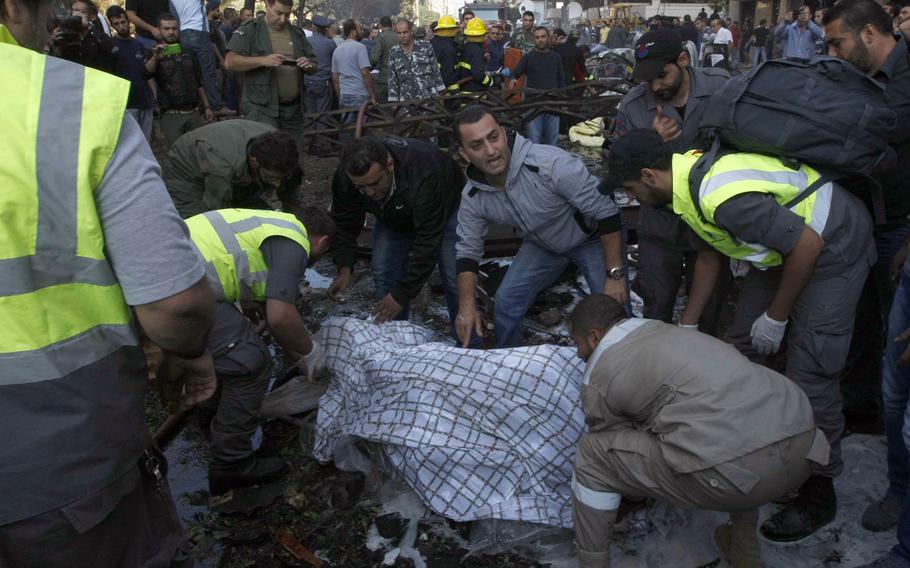 Emergency workers come to the scene as bombs outside the Iranian embassy in Beirut killed dozens and wounded scores more on Nov. 19, 2013, in what was widely seen as a retaliation for Iran and Hezbollah's support of Syrian President Bashar Assad.