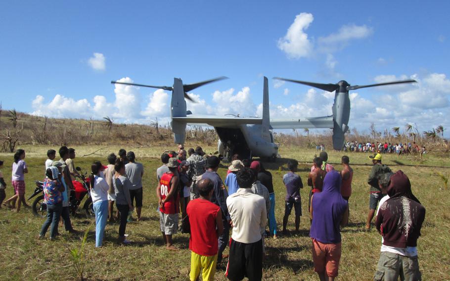 U.S. Marines unload relief supplies from an MV-22 Osprey after Typhoon Haiyan in the area of Luzon, Philippines, Nov. 18, 2013.