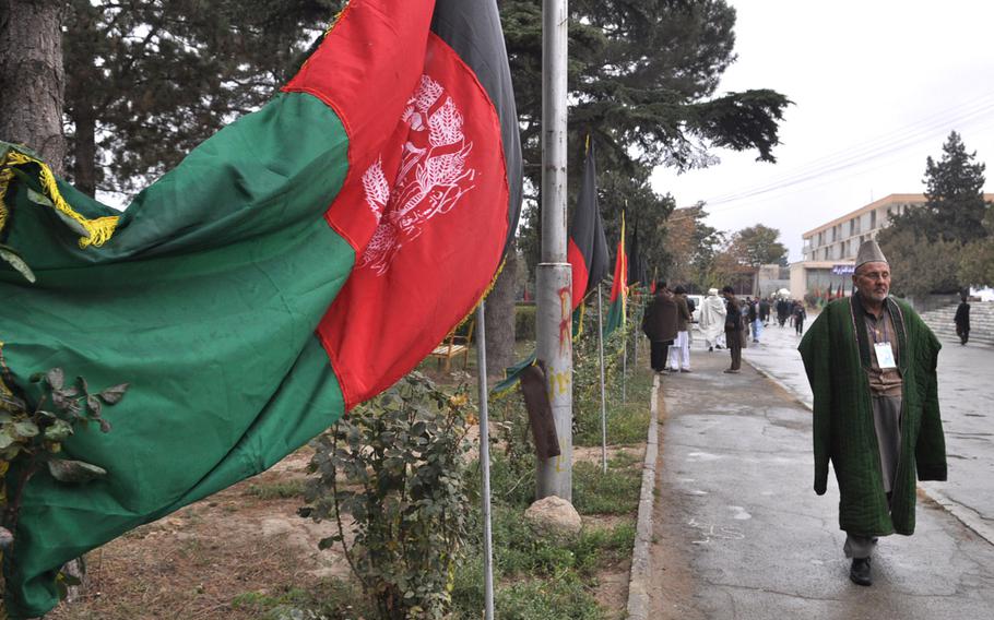 A member of the Afghan Loya Jirga walks past the Kabul Polytechnic University Saturday. The jirga, a gathering of 2,500 community leaders from around the country, was convened by President Hamid Karzai to weigh in on a proposed security agreement with the United States that would pave the way for international troops to stay in Afghanistan past the end of 2014.