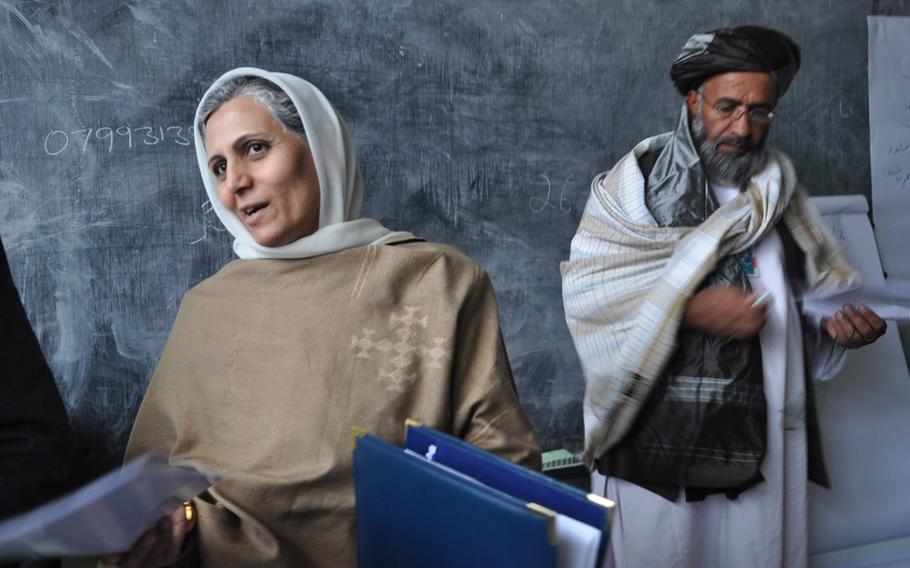 Members of the Afghan Loya Jirga discuss a security agreement that would pave the way for foreign troops to stay in Afghanistan past the end of 2014. The jirga, a gathering of 2,500 community leaders from around the country, was convened by President Hamid Karzai who has said he will respect the council's decision on the security agreement.