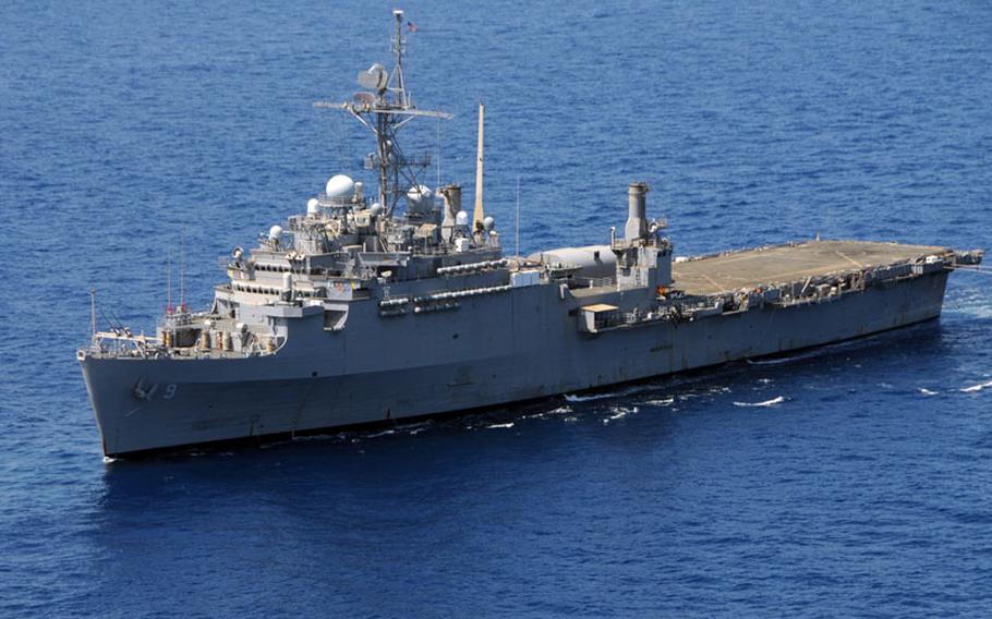 The amphibious transport dock ship USS Denver (LPD 9) cruises the South China Sea.