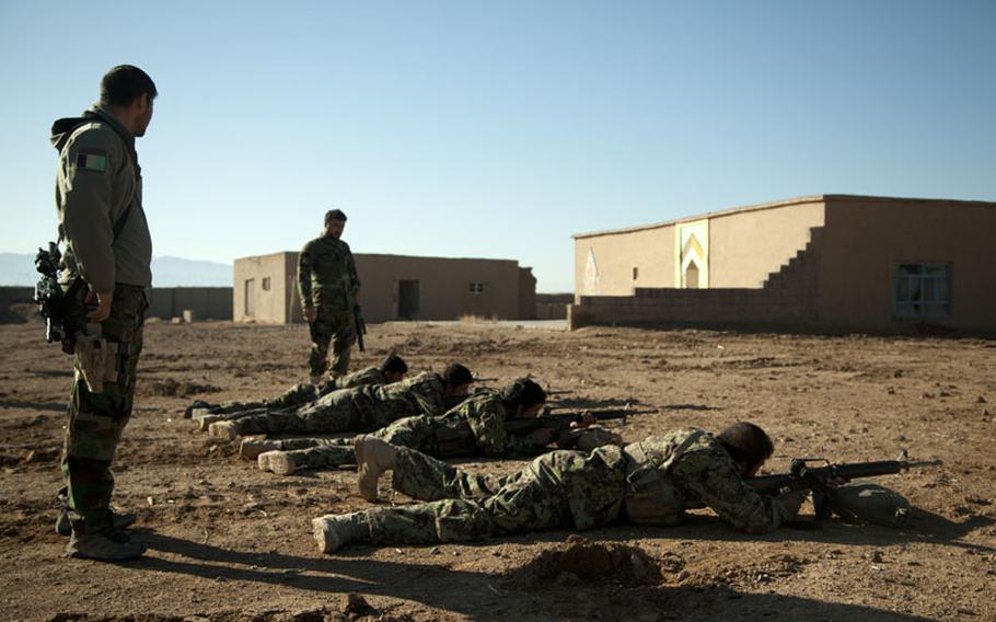 Afghan National Army special forces soldiers watch ANA soldiers fire their weapons during live fire training in Herat province, Afghanistan, on Feb. 7, 2013. A new SIGAR report says the DOD lacks the resources and rigorous procedures it needs to properly keep tabs on the billions of dollars in direct aid it gives to Afghan security forces.