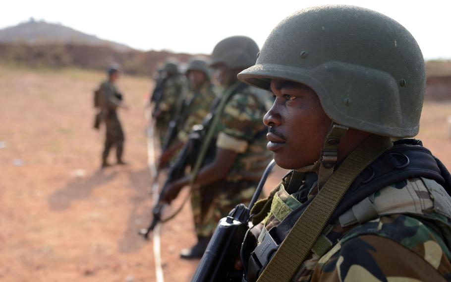 Burundi National Defense Force soldiers prepare to test their marksmanship during an exercise with U.S. Marines and sailors from Special-Purpose Marine Air-Ground Task Force Africa 13 in Mudubugu, Burundi, Aug. 22, 2013.