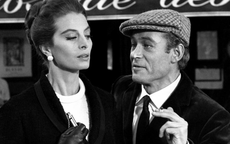 Peter O'Toole and French actress Capucine, during the filming of a scene from "What's New, Pussycat?" at the Closerie de Lilas café on Paris' Boulevard Montparnasse in 1964.
