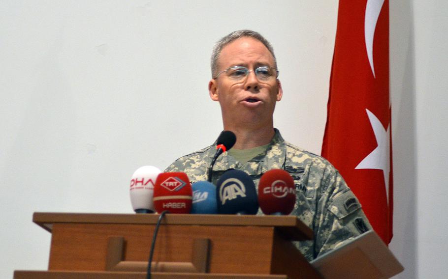 U.S. Army Col. Greg Brady, commander of the 10th Army Air and Missile Defense Command, speaks at a transfer of authority ceremony in Gaziantep, Turkey on Dec. 13, 2013.