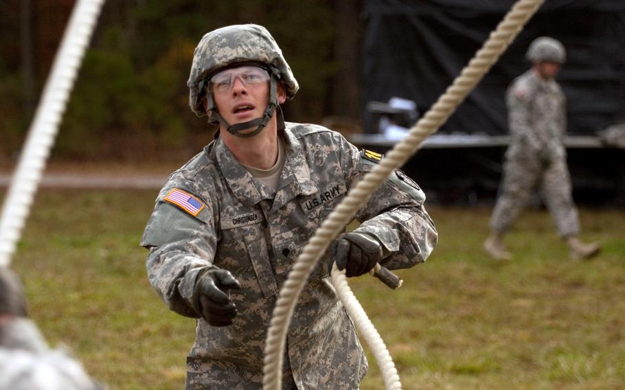 Spc. Adam Christensen participates in the leadership reaction course event as a part of the 2013 Army Best Warrior Competition at Fort Lee, Va., on Nov. 21, 2013. Christensen went on to win the award for soldier of the year at the competition.