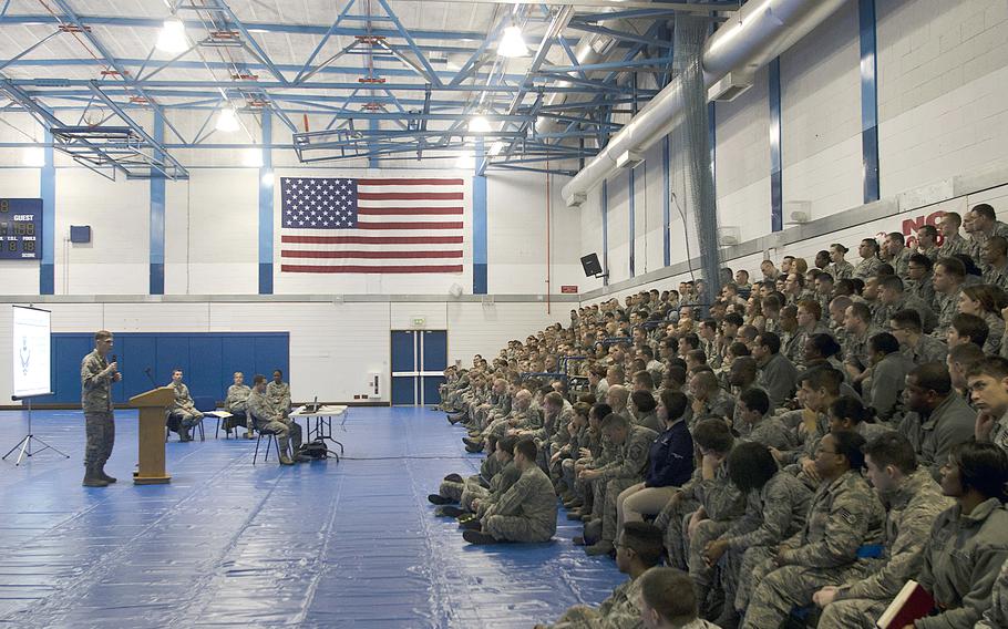 Maj. Ryan Richardson, 48th Support Squadron commander, conducts a town-hall meeting at RAF Lakenheath, England, on Monday, Dec. 16, 2013, to discuss Air Force personnel cuts. The pending cuts are part of an effort by the Air Force to deal with fiscal restraints imposed by sequestration.