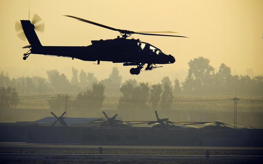 An AH-64 Apache Attack Helicopter hovers before takeoff from Balad Air Base, Iraq, on Jan 3, 2008.