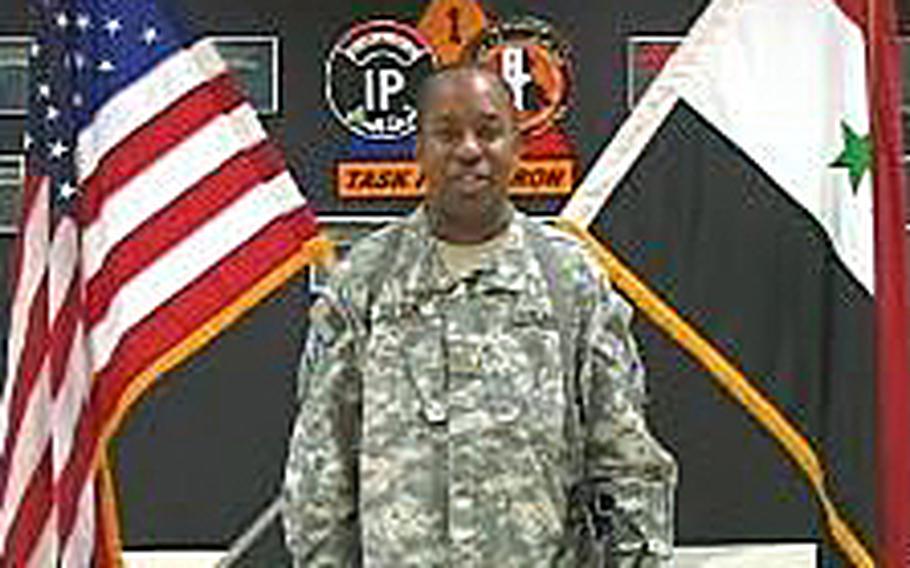Video screen grab shows then Army Maj. Brian Lofton sending a holiday greeting from Tikrit, Iraq, to family and friends in Jackson, Miss., in 2007.