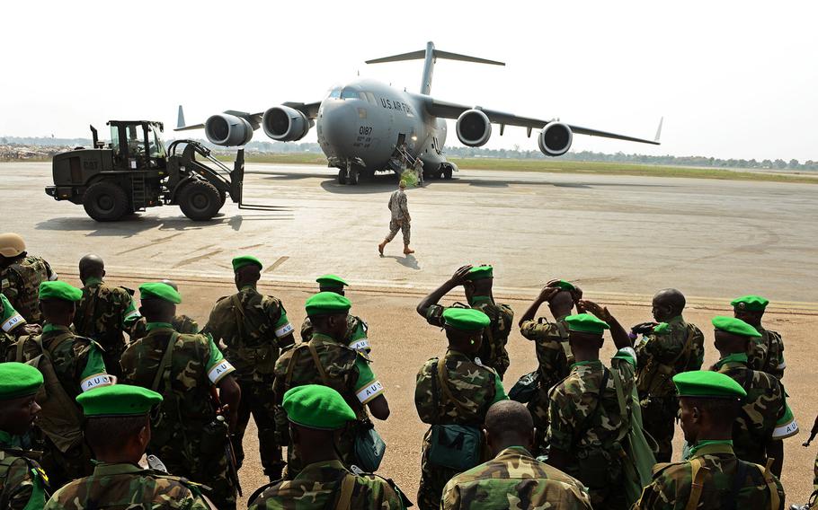 Rwandan soldiers form up after a C-17 Globemaster III based out of McChord Air Force Base, Wash., dropped them off in the Central African Republic on Jan. 19, 2014.