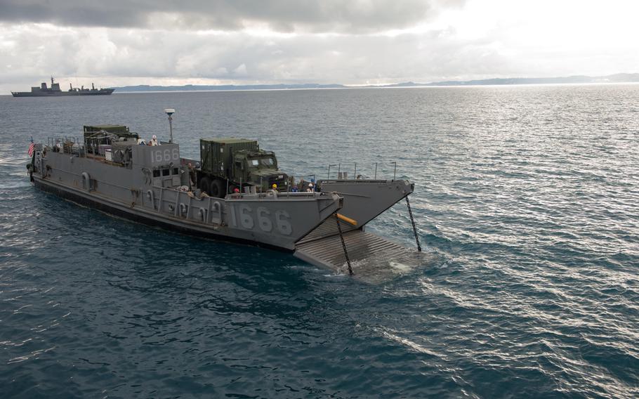Marines and sailors embark mission equipment aboard the USS Denver at White Beach Naval Facility, Okinawa, Feb. 3, 2014. Sailors from the Denver and members of the 3rd Marine Division are heading to Thailand in support of the upcoming Exercise Cobra Gold 2014.
                